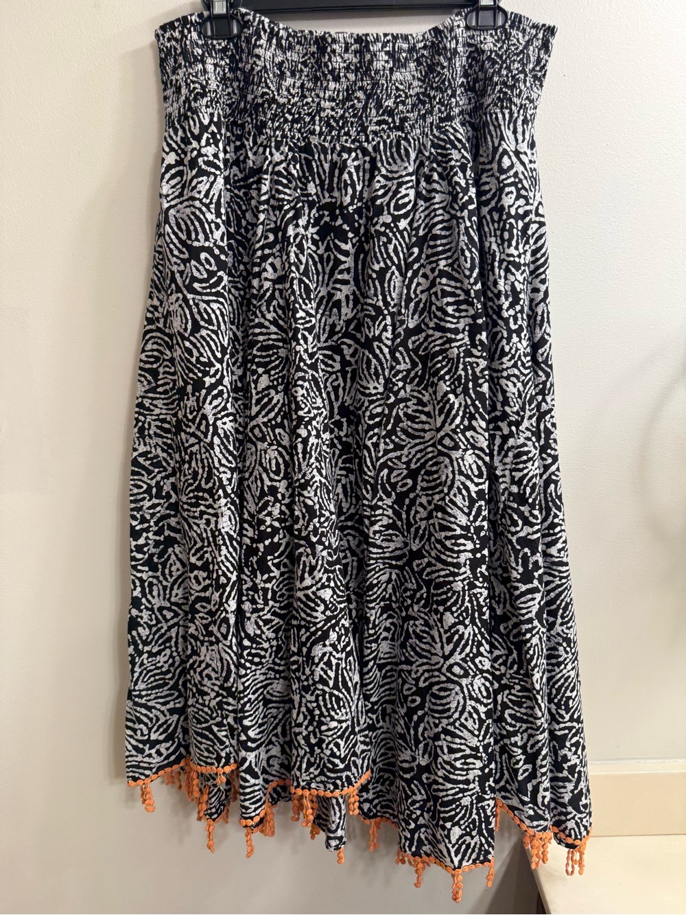 Chelsea & Theodore Black and White Printed A-Line Skirt with Orange Tassel Trim